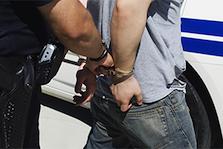 Police Officer Arresting a Person